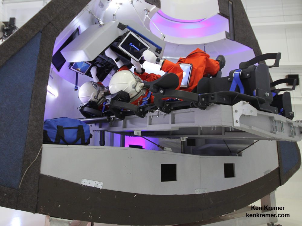 Boeing’s commercial CST-100 'Space Taxi' will carry a crew of five astronauts to low Earth orbit and the ISS from US soil.   Mockup with astronaut mannequins seated below pilot console and Samsung tablets was unveiled on June 9, 2014 at its planned manufacturing facility at the Kennedy Space Center in Florida.  Credit: Ken Kremer - kenkremer.com