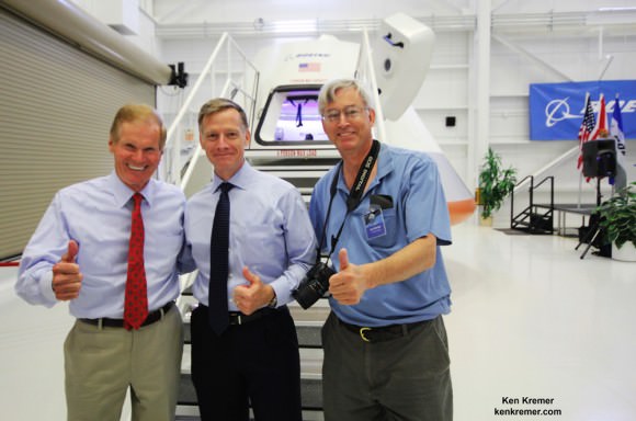 It's 'Thumbs Up' for unveiling of Boeing's CST-100 Space Taxi at NASA's Kennedy Space Center on June 9, 2014.  Florida's US Sen. Bill Nelson (left), final shuttle commander Chris Ferguson (now Director of Boeing’s Crew and Mission Operations, center) and Ken Kremer/Universe Today pose in front of capsule with stairway leading to open hatch.  Credit: Ken Kremer - kenkremer.com 