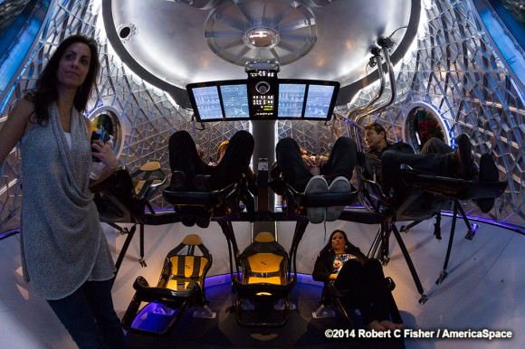 Potential crew members check out the seats of the new SpaceX Dragon V2 next generation astronaut spacecraft. Credit:  Robert Fisher/America Space