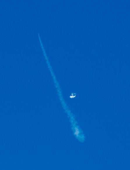 The Low-Density Supersonic Decelerator (LDSD) soars into the sky during a test flight June 28, 2014 (invisible at top of contrail) while its carrier balloon floats in the frame. Credit:  NASA/JPL-Caltech