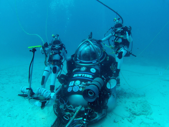 NEEMO 16 during a simulated asteroid mission. From left, Dottie Metcalf-Lindenburger (NASA astronaut), Andrew Abercromby (NASA deputy project manager for the multi mission space exploration vehicle) and Timothy Peake (ESA). Credit: ESA / Herve Stevenin