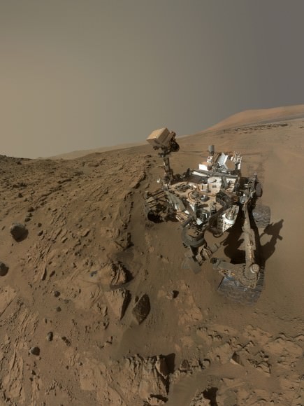 NASA's Mars Curiosity Rover captures a selfie to mark a full Martian year -- 687 Earth days -- spent exploring the Red Planet.  Curiosity Self-Portrait was taken at the  'Windjana' Drilling Site in April and May 2014 using the Mars Hand Lens Imager (MAHLI) camera at the end of the roboic arm.  Credit: NASA/JPL-Caltech/MSSS