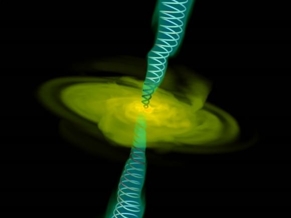 A computer simulation of gas (yellow) falling into a black hole, and jets emanating from the singularity. Credit: Alexander Tchekhovskoy (LBNL)