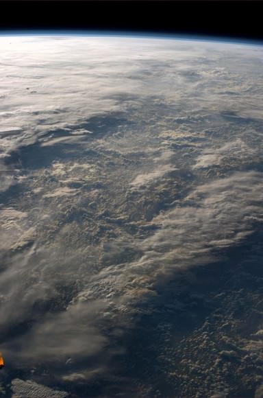 “Sometimes our atmosphere looks incredibly complex and three-dimensional, sometimes you don't even see it. Manchmal schaut unsere Atmosphäre unglaublich Komplex und dreidimensional aus, manchmal fast unsichtbar.”  Taken from the ISS on 5 July 2014. Credit: ESA/Alexander Gerst