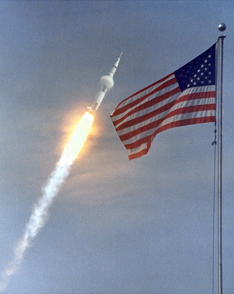 Apollo 11 Launch.  The American flag heralded the launch of Apollo 11, the first lunar landing mission, on July 16, 1969. NASA was the first to put people on the Moon, and the only ones, so far. Whatever else happens, that was an ambitious, triumphant mission. Credit: NASA