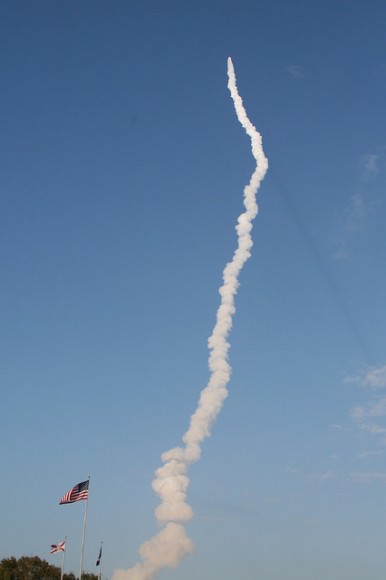 STS-131 Discovery flies high in the sky following its launch Feb. 24, 2011. Credit: Robert Karma
