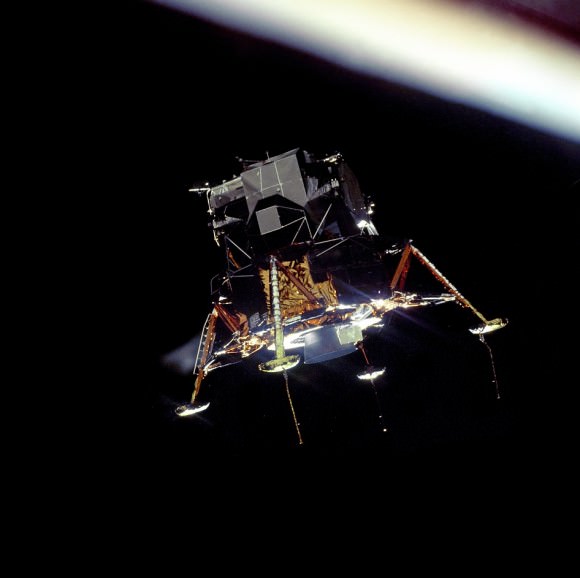 The Eagle Prepares to Land.  The Apollo 11 Lunar Module Eagle, in a landing configuration was photographed in lunar orbit from the Command and Service Module Columbia. Inside the module were Commander Neil A. Armstrong and Lunar Module Pilot Buzz Aldrin. The long rod-like protrusions under the landing pods are lunar surface sensing probes. Upon contact with the lunar surface, the probes sent a signal to the crew to shut down the descent engine.  Image Credit: NASA