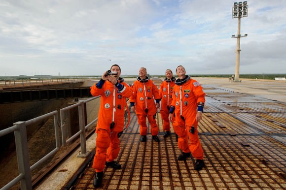 The STS-135 crew admires the shuttle Atlantis just prior to launching July 8, 2011. From left, Rex Walheim, Doug Hurley, Sandy Magnus and Chris Ferguson. Credit: NASA/Bill Ingalls