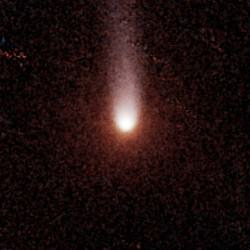Comet Siding Spring observed by the Spitzer Space Telescope in two wavelengths of infrared light in March 2014. The hint of blue-white corresponds to dust, red-orange to gas. Credit: NASA