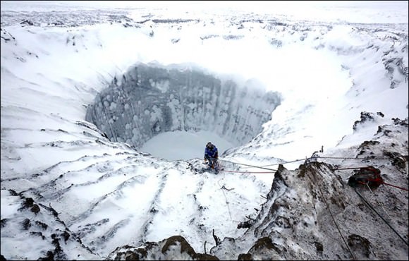 Researchers descend into an ice-covered Yamal Crater in Siberia. Credit: Vladimir Pushkarev/Russian Centre of Arctic Exploration (via Siberian Times) 