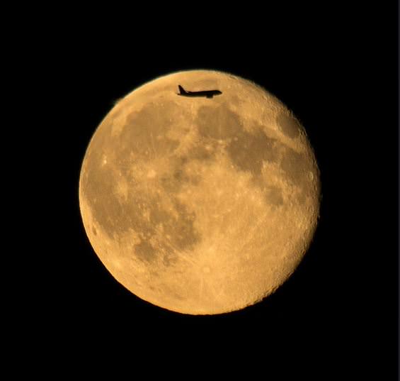 Moonrise with a flyby. July 13, 2014 from the UK. Credit and copyright: SculptorLil on Flickr. 