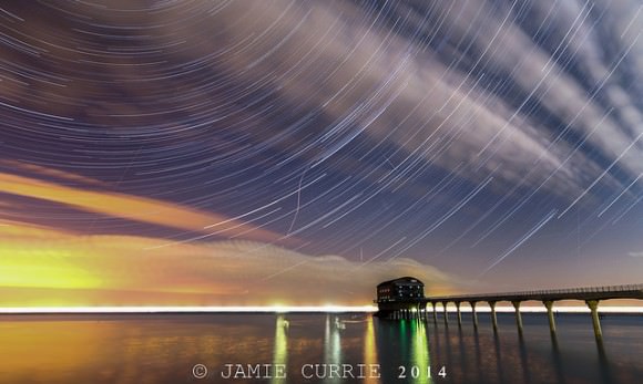 Star trails and the Perseid meteors over the Bembridge LifeBoat Station on the Isle of Wight. Credit and copyright: Jamie Currie. 