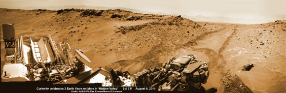 2 Earth Years on Mars!  NASA’s Curiosity rover celebrated the 2nd anniversary on Mars at ‘Hidden Valley’ as shown in this photo mosaic view captured on Aug. 6, 2014, Sol 711.  Note the valley walls, rover tracks and distant crater rim. Navcam camera raw images stitched and colorized.  Credit: NASA/JPL-Caltech/Ken Kremer-kenkremer.com/Marco Di Lorenzo