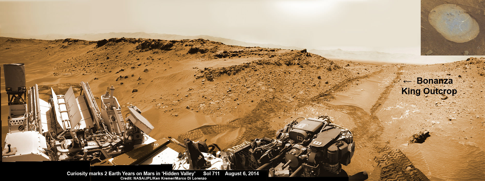 NASA’s Curiosity rover looks back to ramp with potential 4th drill site target at ‘Bonanza King’ rock outcrop in ‘Hidden Valley’ in this photo mosaic view captured on Aug. 6, 2014, Sol 711.  Inset shows results of brushing on Aug. 17, Sol 722, that revealed gray patch beneath red dust.  Note the rover’s partial selfie, valley walls, deep wheel tracks in the sand dunes and distant rim of Gale crater beyond the ramp. Navcam camera raw images stitched and colorized.  Credit: NASA/JPL-Caltech/Ken Kremer-kenkremer.com/Marco Di Lorenzo