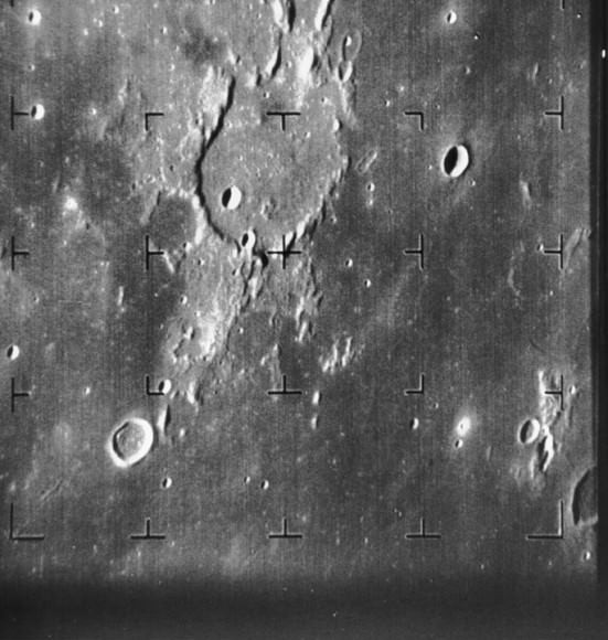 Guericke Crater as seen by Ranger 7. Ranger 7 B-camera image of Guericke crater (11.5 S, 14.1 W, diameter 63 km) taken from a distance of 1335 km. The dark flat floor of Mare Nubium dominates most of the image, which was taken 8.5 minutes before Ranger 7 impacted the Moon on 31 July 1964. The frame is about 230 km across and north is at 12:30. The impact site is off the frame to the left. Credit:  NASA/JPL-Caltech