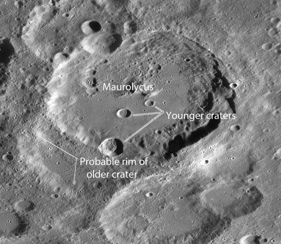At least three different impact sequences are illustrated in this photo. Maurolycus appears to lie atop an older crater, while younger, sharp-rimmed craters pock its center and southern rim. Even a 3-inch telescope will show signs of all three ages. Credit: Damian Peach