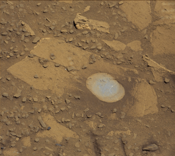 Curiosity rover used the Dust Removal Tool on its robotic arm to brush aside reddish, more-oxidized dust, revealing a gray patch of less-oxidized rock material at a target called "Bonanza King," visible in this image from the rover's Mast Camera (Mastcam). Credit: NASA/JPL-Caltech/MSSS