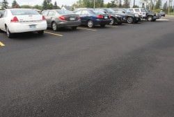Comet colored parking lots have been the rage for years. Both comets and fresh asphalt reflect about the same amount of light. Credit: Bob King