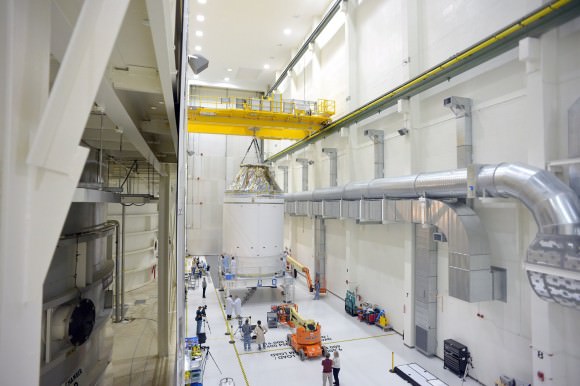 NASA’s first completed Orion crew and service modules being moved inside the High Bay at the Neil Armstrong Operations and Checkout Facility at Kennedy Space Center in Florida in early September 2014.   Credit: NASA/Rad Sinyak 