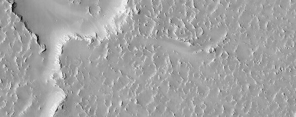 Older lava flows in Daedalia Planum on Mars. Picture taken by the High Resolution Imaging Science Experiment (HiRISE) on the Mars Reconnaissance Orbiter. Credit: NASA/JPL/University of Arizona 