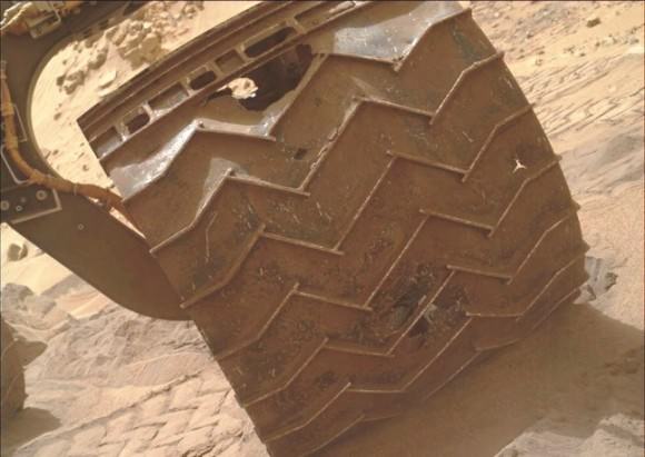 In late 2013, wear and tear accelerated on Curiosity's wheels, the result of crossing boulder-strewn terrain. Clearly signs of punctures, tears and dents are seen in the photo taken by Curiosity performing a self-inspection. While it certainly raised alarm, mission planners remain confident that it can be handled and will not limit the duration of the mission.(Credits: NASA/JPL)