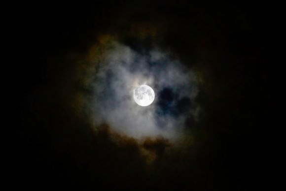 Supermoon through the clouds on September 9, 2014. Credit and copyright: scul-001 on Flickr. 