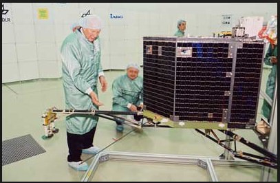 Clean Room photo of Philae with Principal Investigator Dr. Helmut Rosenbauer, Director at the Max-Planck-Institute for Aeronomy. Philae's mass is 100 kg including 21 kg of instrument payload It's dimensions are 1 × 1 × 0.8 meters  (3.3 × 3.3 × 2.6 ft) Photo Credit: Max Planck Institute, Filser)
