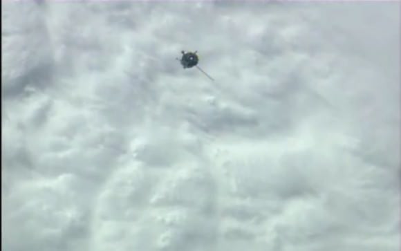 Screenshot from NASA TV of the Soyuz-TMA14M arriving with just one solar panel deployed. 
