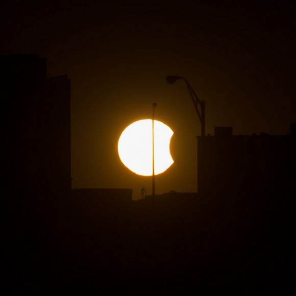 A partial solar eclipse is visable just before sunset Thursday, Oct. 23, 2014, in Arlington, VA. Photo Credit: (NASA/Bill Ingalls)