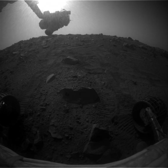 A dramatic, shadowy picture showing part of the Opportunity rover on Mars lit by the Sun (at top). Picture taken Sol 3,812 in October 2014. Credit: NASA/JPL-Caltech