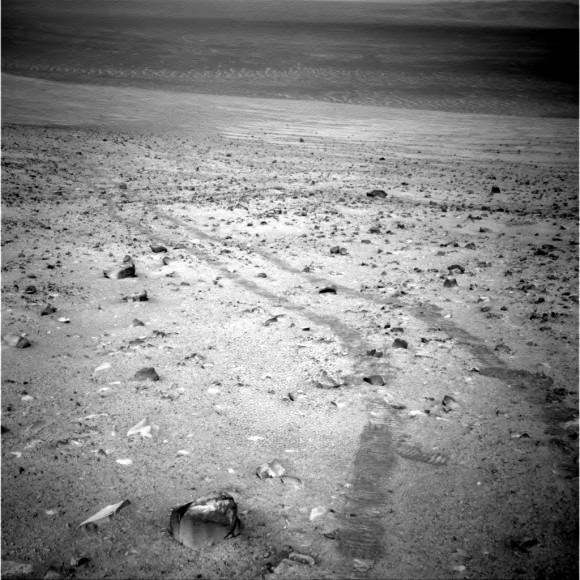 Tracks from the Curiosity rover across Martian terrain on Sol 3,798 in October 2014. Credit: NASA/JPL-Caltech/Cornell Univ./Arizona State Univ.