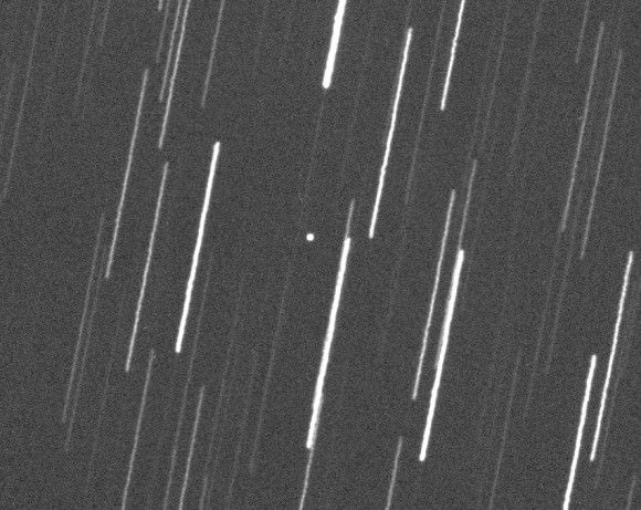 Near-Earth asteroid 2014 SC324 caught in the camera on October 23. The telescope tracked on the zippy space rock, causing the stars to trail. Credit: Gianluca Masi