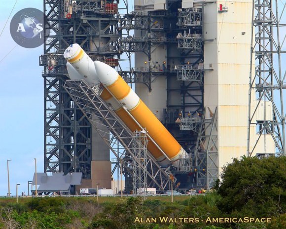 The United Launch Alliance Delta-IV Heavy rocket tasked with launching NASA’s Orion EFT-1 mission being hoisted vertical atop Space Launch Complex-37B at Cape Canaveral Air Force Station in Florida on the morning of Oct. 1, 2014. Photo Credit: Alan Walters / AmericaSpace