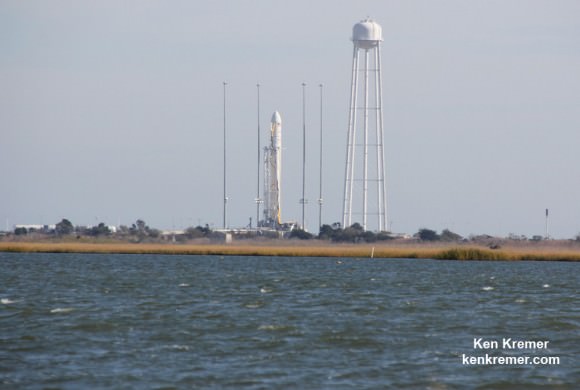View of Orbital Sciences Antares  rocket standing at Launch Pad 0A three hours prior to catastrophic failure following liftoff from NASA’s Wallops Flight Facility, VA, on Oct. 28, 2014, at 6:22 p.m. Note all 4 lighting suppression rods intact. Credit: Ken Kremer – kenkremer.com