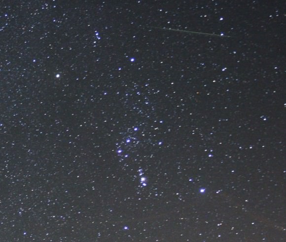 An Orionid meteor slashes across the top of the frame directly above the constellation Orion early this morning October 22, 2014. Details: 24mm lens, f/2.8, 30-seconds at ISO 1600. Credit: Bob King