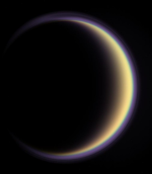 A halo of light surrounds Saturn's moon Titan in this  backlit picture, showing its atmosphere. Credit: NASA/JPL/Space Science Institute