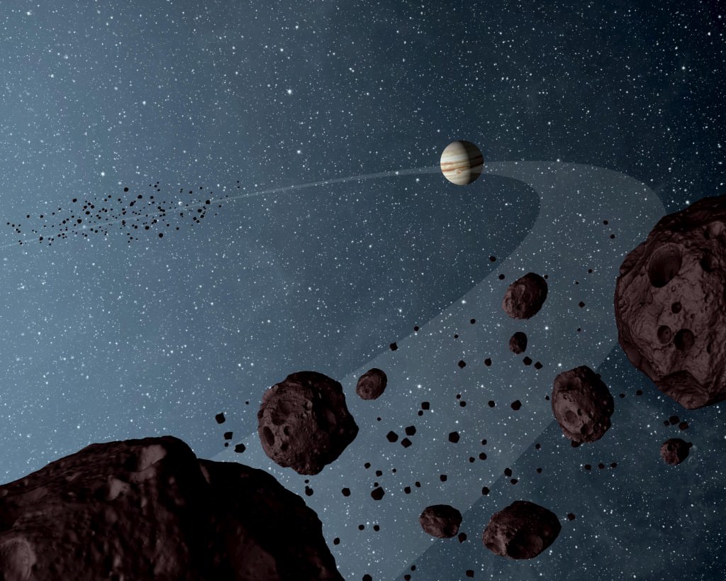 Artist's diagram of Jupiter and some Trojan asteroids nearby the gas giant. Credit: NASA/JPL-Caltech