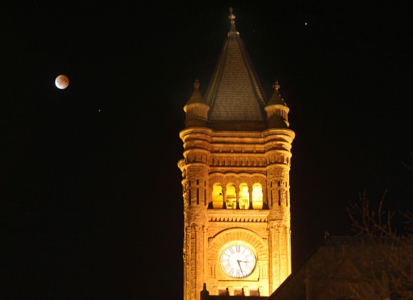 Sometimes it's nice to have a foreground object to add character to your eclipse photos. Last April's totally eclipsed moon joins the old Central High School clock tower in downtown Duluth, Minn. Mars at upper right. Details: 80mm lens, f/5, 1.6-second exposure at ISO 400 on a tripod. Credit: Bob King