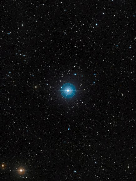 Beta Pictoris is located about 60 light-years away towards the constellation of Pictor (the Painter's Easel) and is one of the best-known examples of a star surrounded by a dusty debris disc. Earlier observations showed a warp of the disc, a secondary inclined disc and comets falling onto the star, all indirect, but tell-tale signs that strongly suggested the presence of a massive planet. Observations done with the NACO instrument on ESO’s Very Large Telescope in 2003, 2008 and 2009, have proven the presence of a planet around Beta Pictoris. It is located at a distance between 8 and 15 times the Earth-Sun separation — or Astronomical Units — which is about the distance Saturn is from the Sun. The planet has a mass of about nine Jupiter masses and the right mass and location to explain the observed warp in the inner parts of the disc. This image, based on data from the Digitized Sky Survey 2, shows a region of approximately 1.7 x 2.3 degrees around Beta Pictoris.  Credit: ESO/Sky Survey II