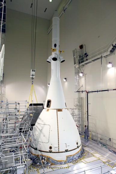 Technicians complete final assembly of NASA’s first Orion spacecraft with installation of the  last ogive close out panels on the Launch Abort System that smooth airflow. Credit: Photo credit: Kim Shiflett