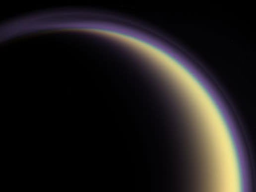 A composite image of Titan's atmosphere, created using blue, green and red spectral filters to create an enhanced-color view.  Image Credit: NASA/JPL/Space Science Institute 
