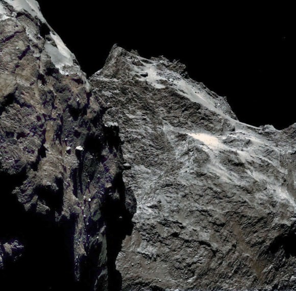 Jagged cliffs and prominent boulders are visible in this color image taken by OSIRIS, the Rosetta spacecraft’s scientific imaging system, on September 5, 2014 from a distance of 38.5 miles (62 km). Credit: ESA/Rosetta/MPS for OSIRIS team