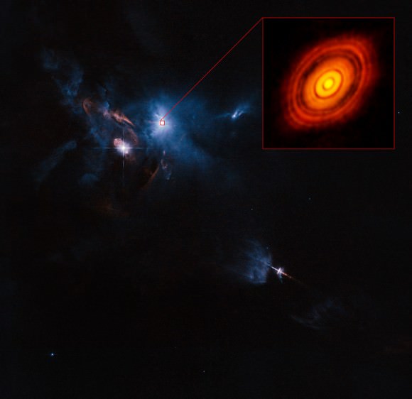 This is a composite image of the young star HL Tauri and its surroundings using data from ALMA (enlarged in box at upper right) and the NASA/ESA Hubble Space Telescope (rest of the picture). This is the first ALMA image where the image sharpness exceeds that normally attained with Hubble.  Credit: ALMA (ESO/NAOJ/NRAO)
