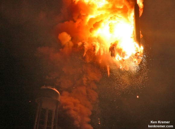 Close up view of Antares descent into hellish inferno shows south side first stage engine intact after north side engine at base of Orbital Sciences Antares rocket exploded moments after blastoff from NASA’s Wallops Flight Facility, VA, on Oct. 28, 2014. Credit: Ken Kremer – kenkremer.com