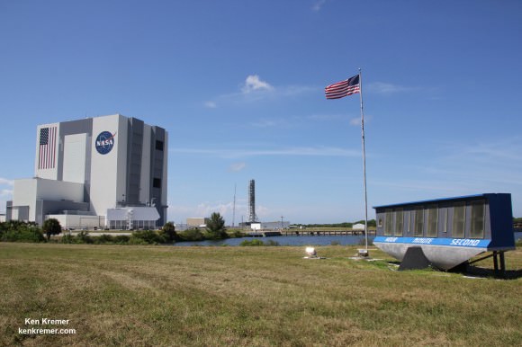 Famous KSC Press Site Countdown Clock and US Flag with VAB during SpaceX CRS-5 launch in September 2014. Credit: Ken Kremer – kenkremer.com