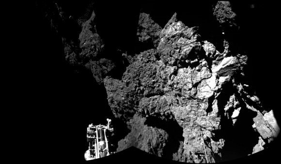 Rosetta’s lander Philae is safely on the surface of Comet 67P/Churyumov-Gerasimenko, as these first two CIVA images confirm. One of the lander’s three feet can be seen in the foreground. The image is a two-image mosaic. Credit: ESA/Rosetta/Philae/CIVA