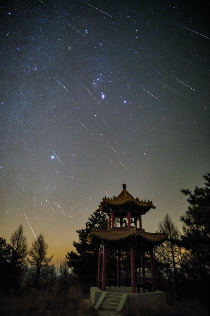 Geminid meteors over Beijing, China. A stacked image of  more than 20 meteors, taken in just 140 minutes. Credit and copyright: Steed Yu.