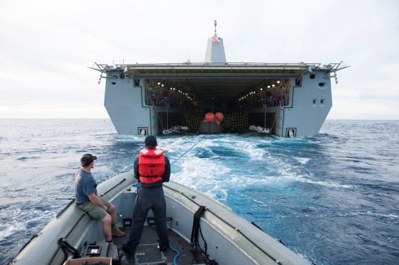 The Orion spacecraft is guided into the well deck of the USS Anchorage during recovery operations following splashdown. Credit: U.S. Navy