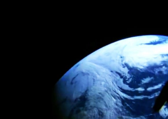A camera in the window of NASA's Orion spacecraft looks back at Earth during its unpiloted flight test in orbit. Credit: NASA Television