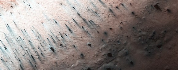 As spring takes hold in the southern polar region of Mars on Sept. 27, 2014, cracks are now developing in the ice at "Inca City" with multiple new dust fans appearing. Cracks develop when the ice does not have a path to easily rupture and release gas. Picture taken by the Mars Reconnaissance Orbiter's HiRISE camera. Credit: NASA/JPL/University of Arizona